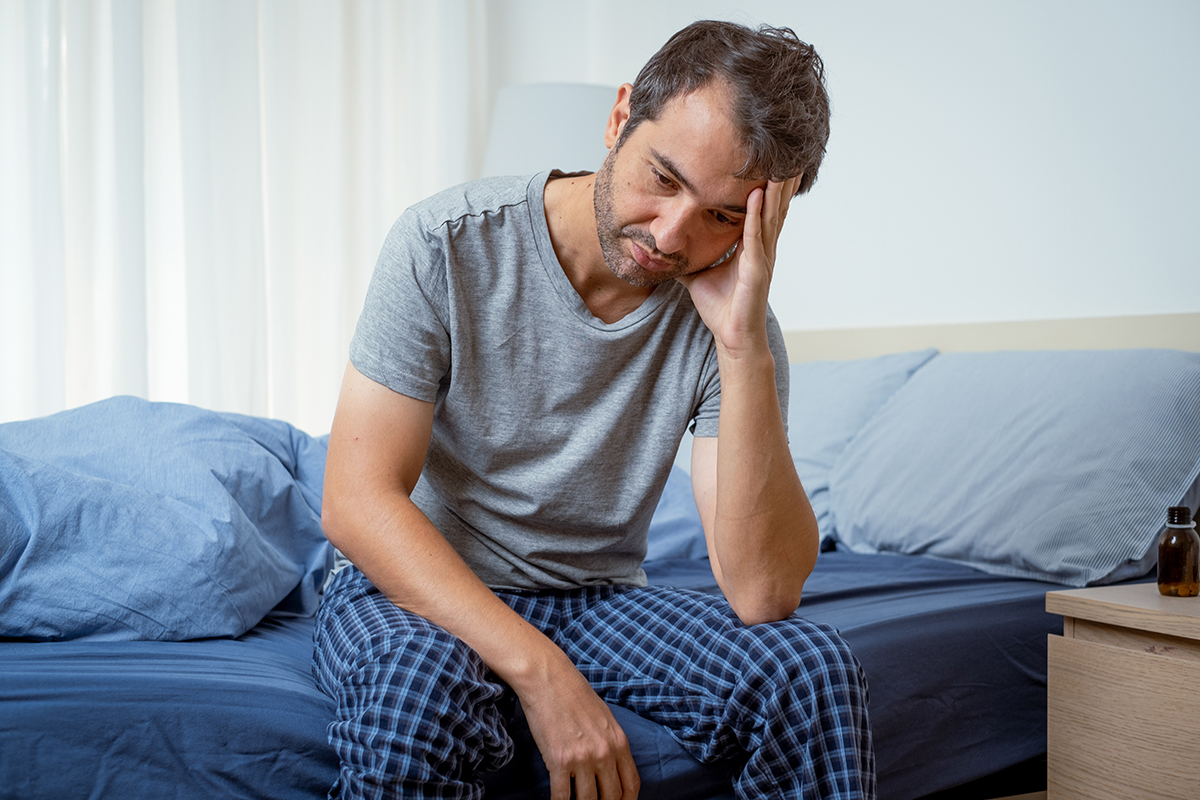 Sleep disorders.Man having trouble waking up.