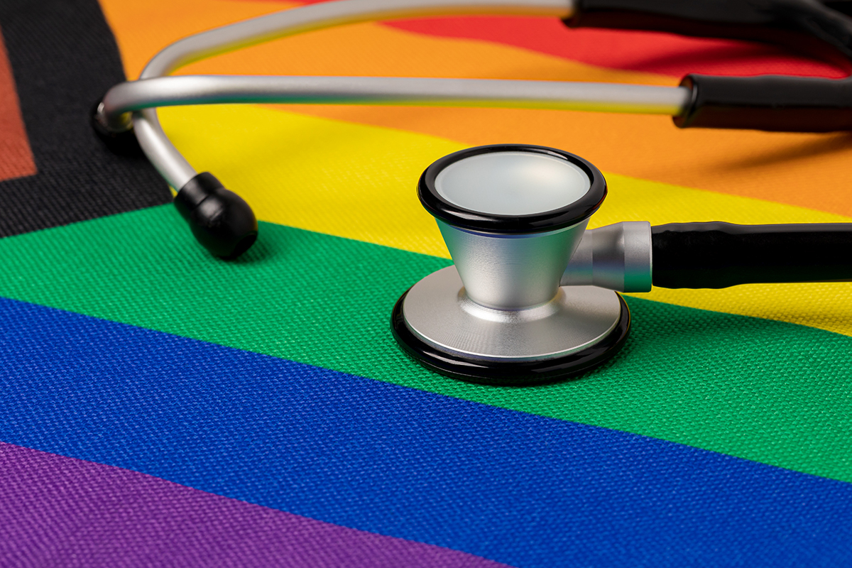 Rainbow pride flag and stethoscope. Transgender and LGBTQ+ healt